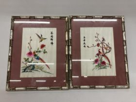 A PAIR OF ORIENTAL SILK HAND EMBROIDERED ART IN BAMBOO FRAMES