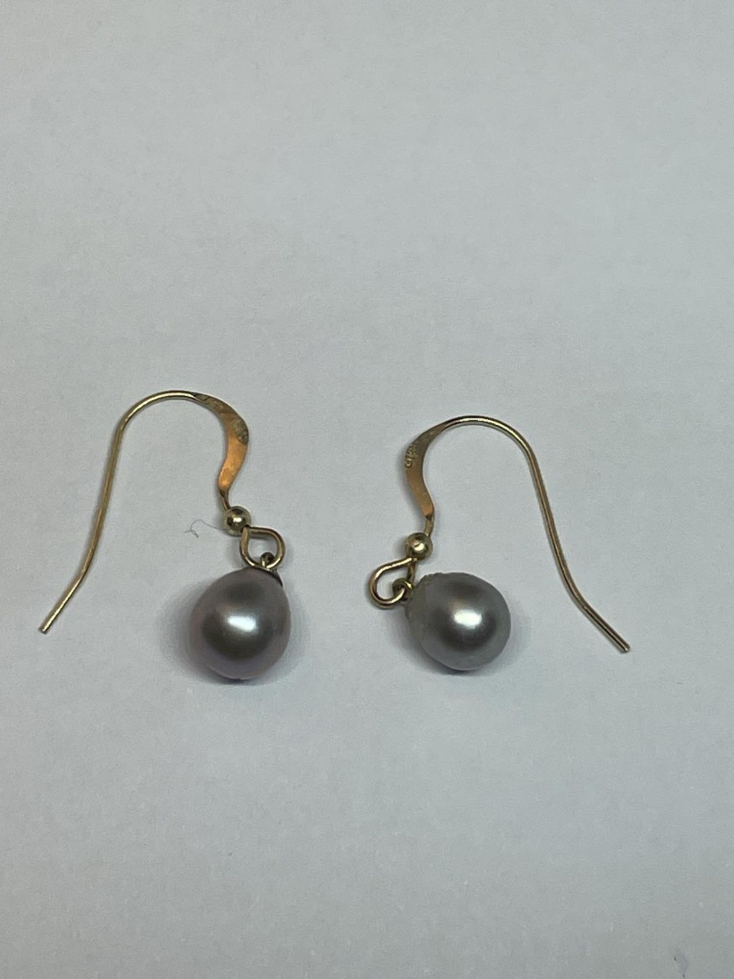 A PAIR OF 14 CARAT GOLD AND PEARL EARRINGS GROSS WEIGHT 1.28 GRAMS