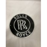 A CAST BLACK AND SILVER ROLLS ROYCE SIGN, DIAMETER 24CM