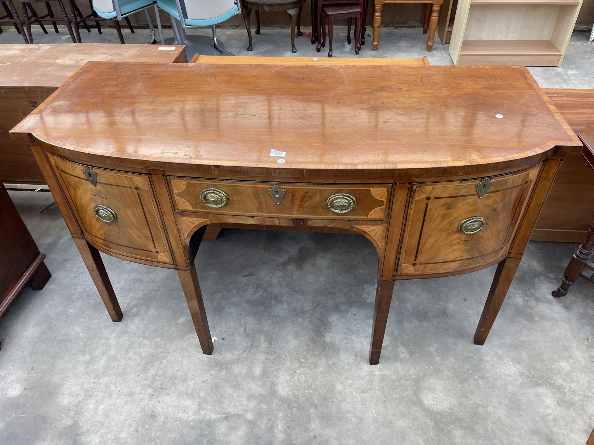 A 19TH CENTURY MAHOGANY INLAID AND CROSSBANDED BOWFRONTED SIDEBOARD ENCLOSING THREE DRAWERS, 60"