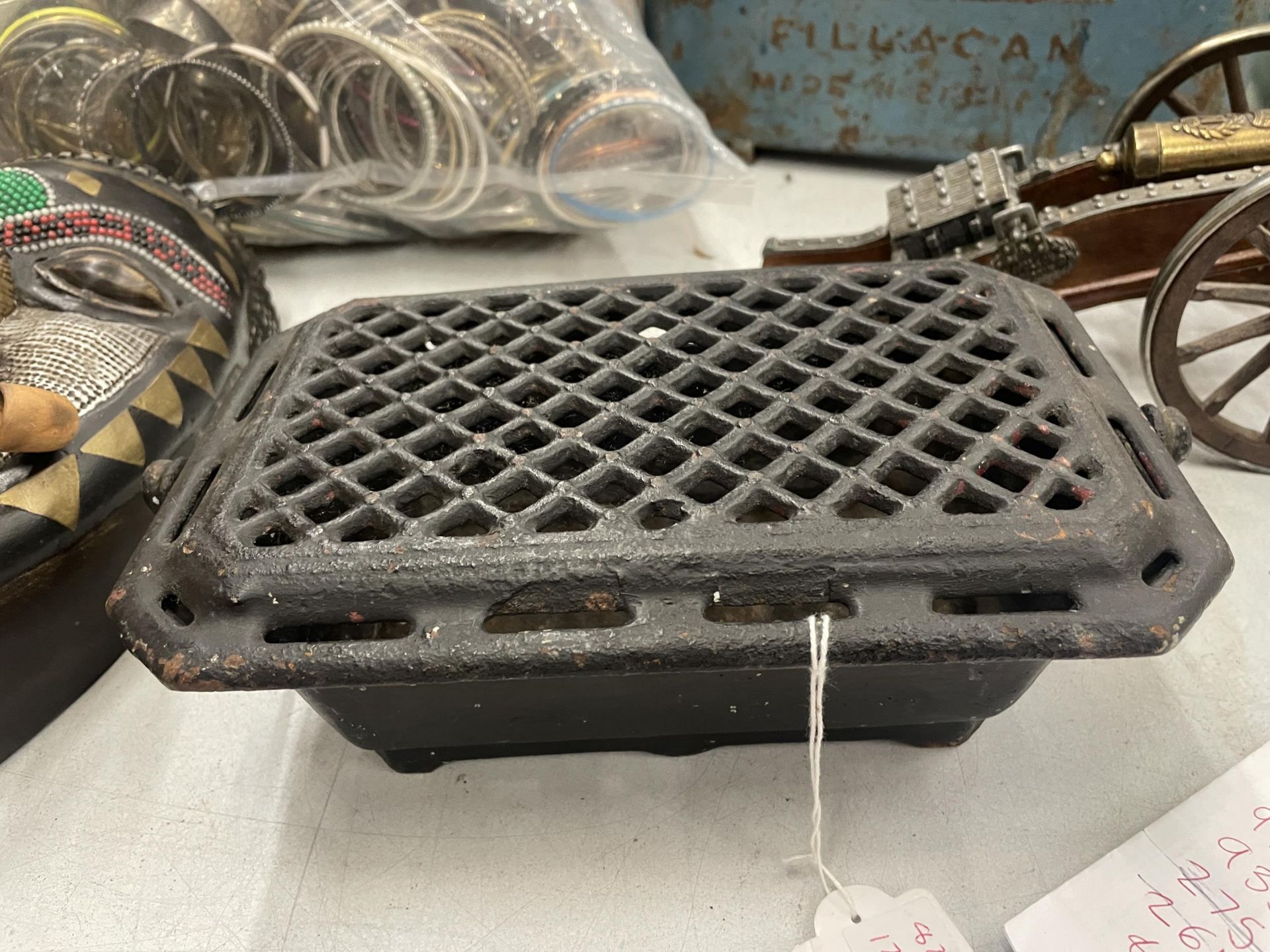 A CAST IRON WARMING PLATE