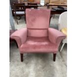 A MODERN PINK UPHOLSTERED FIRESIDE CHAIR