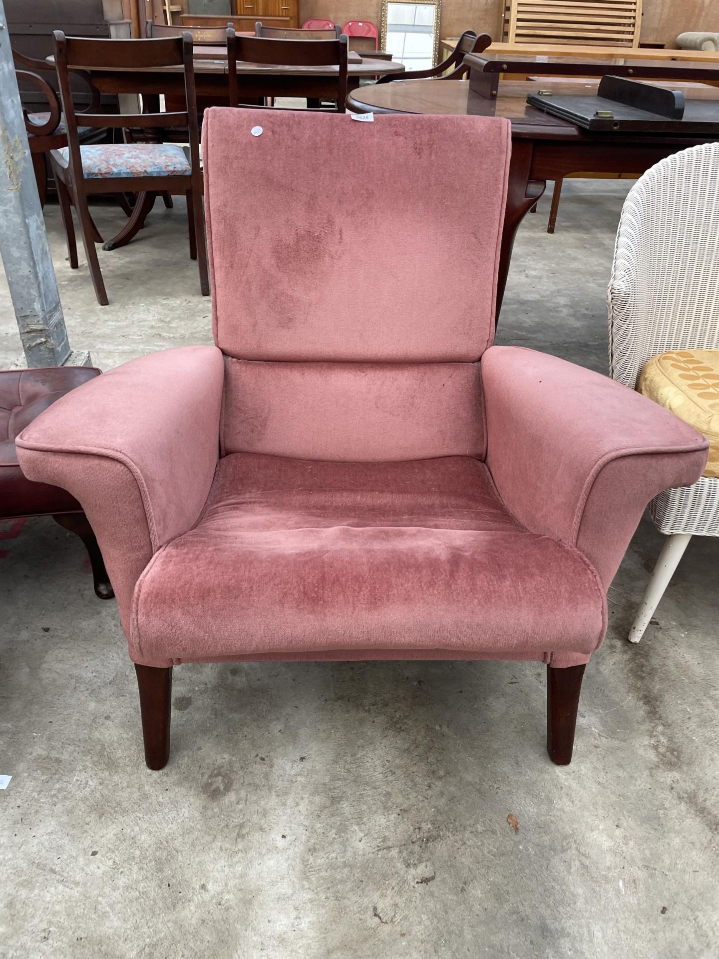 A MODERN PINK UPHOLSTERED FIRESIDE CHAIR