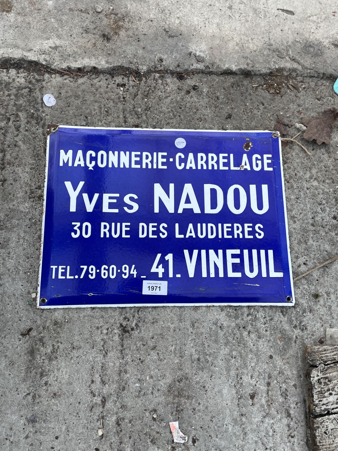 A TIN 'MACONNERIE CARRELAGE' SIGN