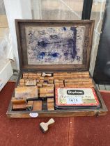 A VINTAGE WOODEN CASED INK LETTER AND NUMBER STAMP SET