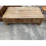 A HARDWOOD COFFEE TABLE ENCLOSING FOUR DRAWERS, 53 X 30"