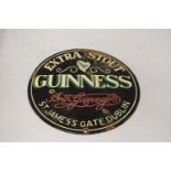 AN ENAMEL EXTRA STOUT GUINNESS CIRCULAR SIGN