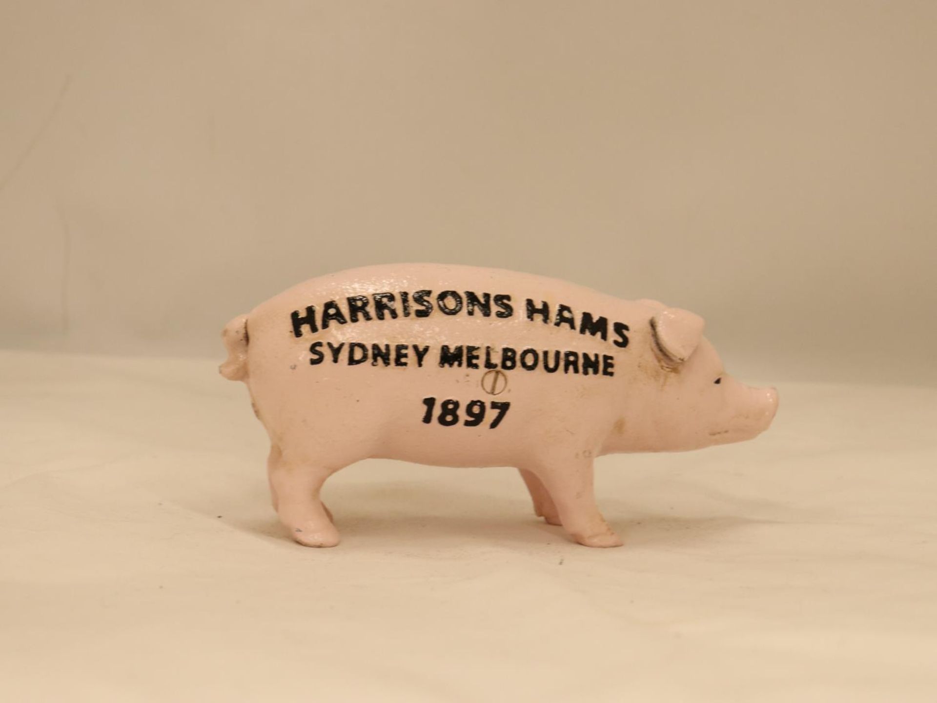 A HEAVY CAST BUTCHERS PIG MONEY BOX