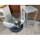 A RETRO 28" DIAMETER REVOLVING TWO SECTION COFFEE TABLE WITH GLASS TOP AND METALWARE AND GLASS