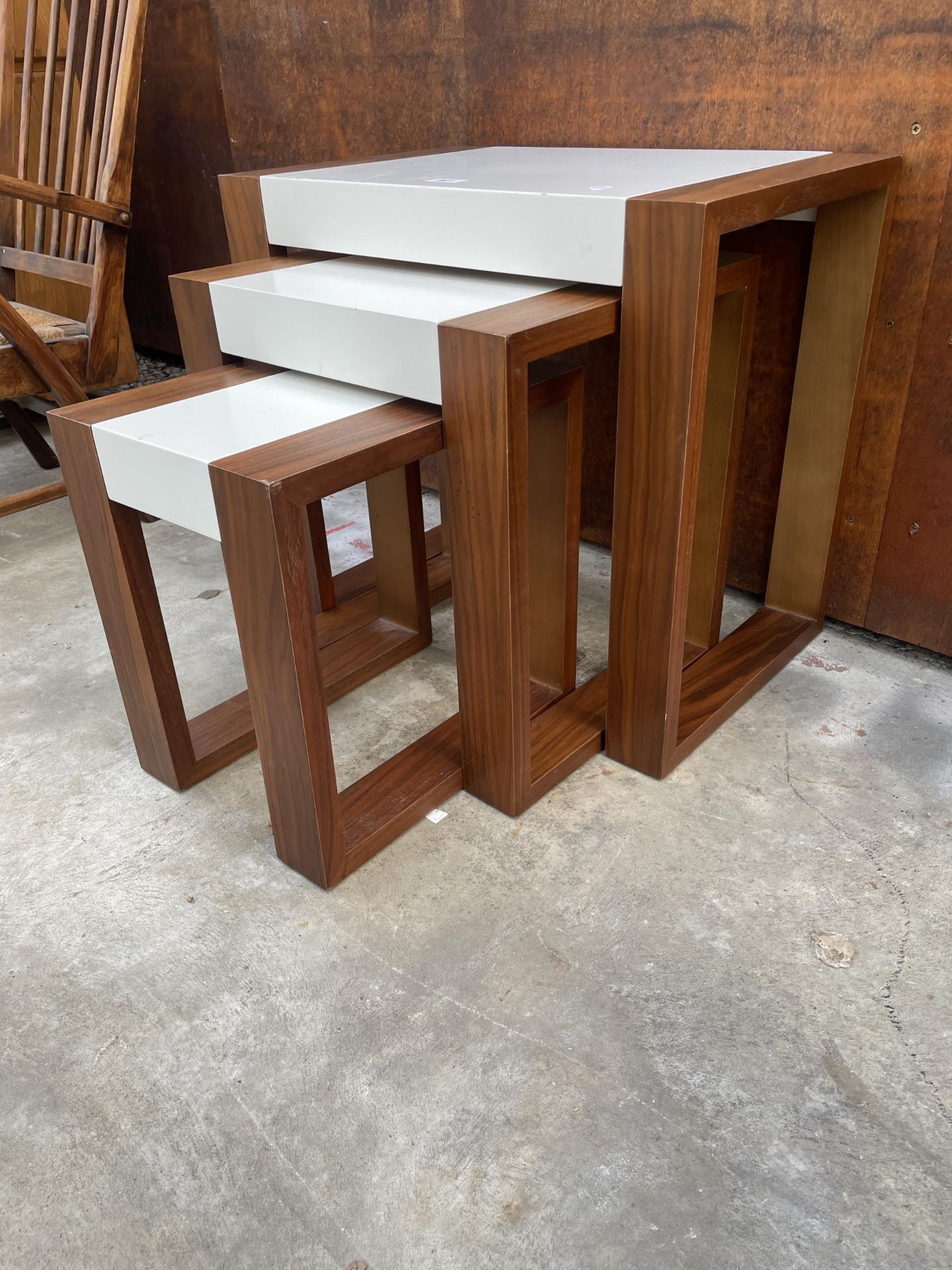A RETRO TEAK AND MELAMINE NEST OF THREE TABLES - Image 2 of 3