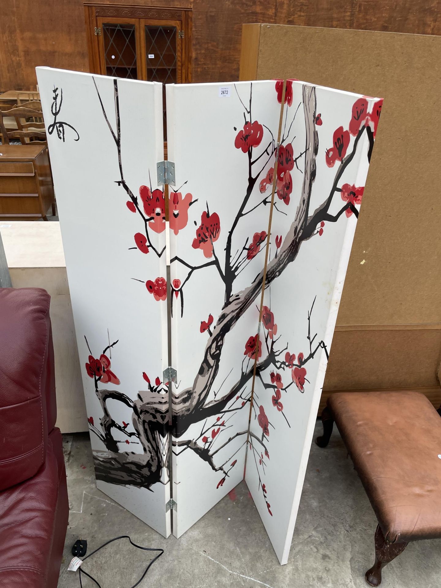 A MODERN THREE DIVISION SCREEN DECORATED WITH FLOWERING TREE