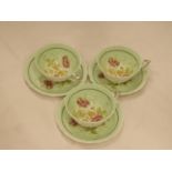 THREE VINTAGE PARAGON CHINA CUPS AND SAUCERS