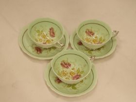 THREE VINTAGE PARAGON CHINA CUPS AND SAUCERS
