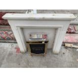 A GAS FIRE WITH DECORATIVE STONE EFFECT SURROUND