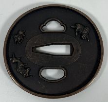 A JAPANESE BRONZE TSUBA WITH MYTHICAL BEAST DESIGN, DIAMETER 7.5 CM