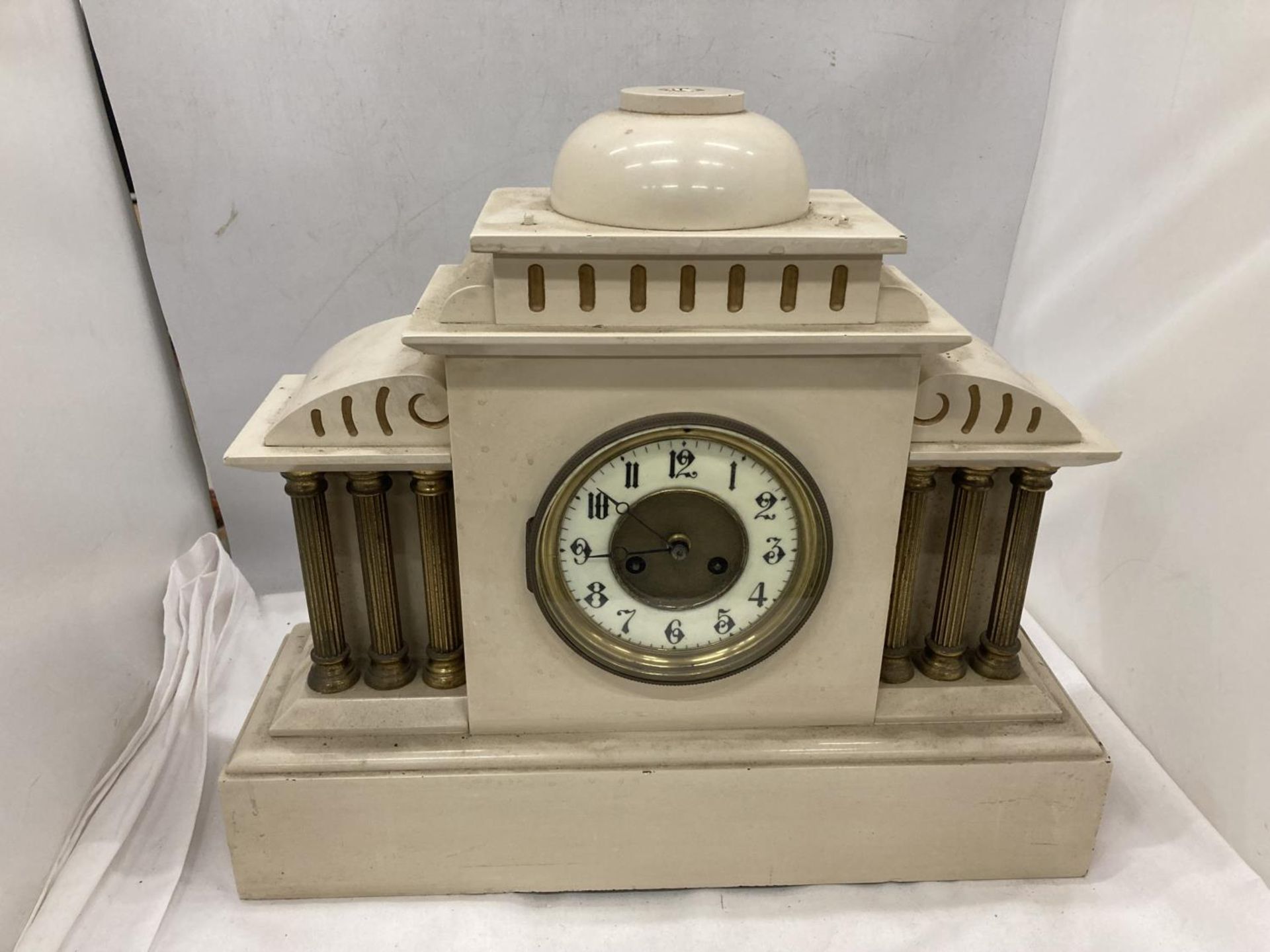 A MARBLE MANTLE CLOCK WITH A SIX COLUMN DESIGN PAINTED BY AM HEPWORTH