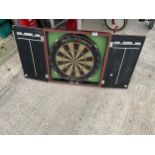 A NODOR CLARKE AND YOUNG DARTBOARD AND WOODEN CUPBOARD MOUNT