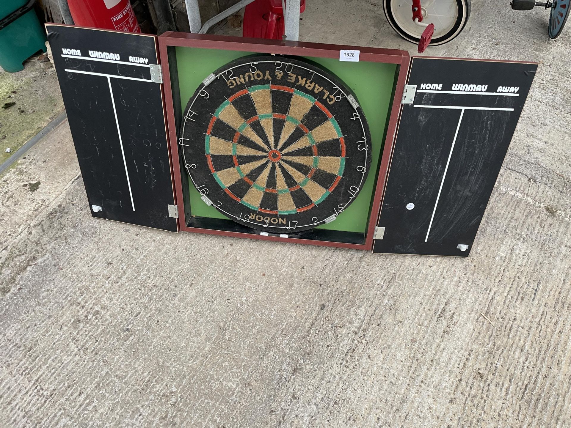 A NODOR CLARKE AND YOUNG DARTBOARD AND WOODEN CUPBOARD MOUNT