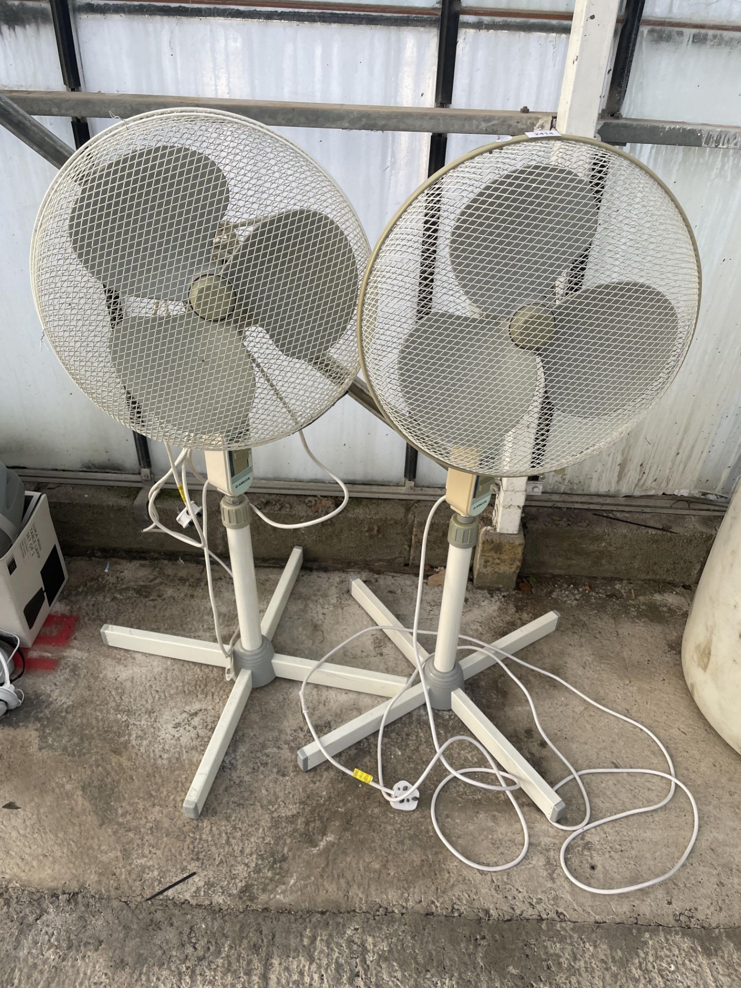 TWO ELECTRIC FLOOR FANS