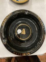 A VINTAGE WADE BLACK AND GOLD GUINNESS ASHTRAY IN VERY GOOD CONDITION