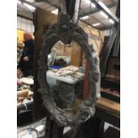 A CARVED FRAME MIRROR