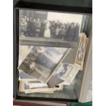 A BOX CONTAINING OLD BLACK AND WHITE AND SEPIA PHOTO'S