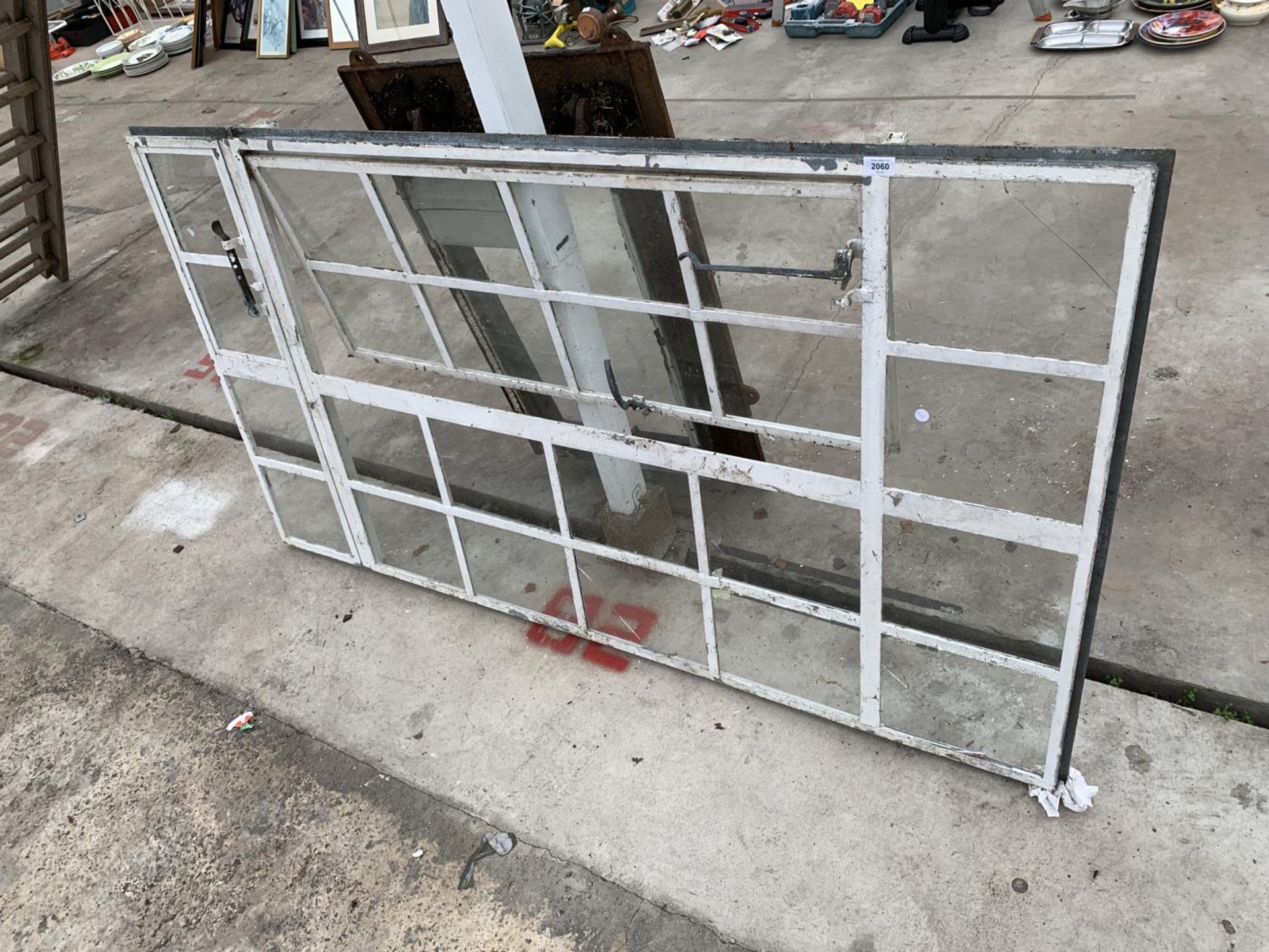 A VINTAGE 24 SECTION CAST METAL WINDOW FRAME