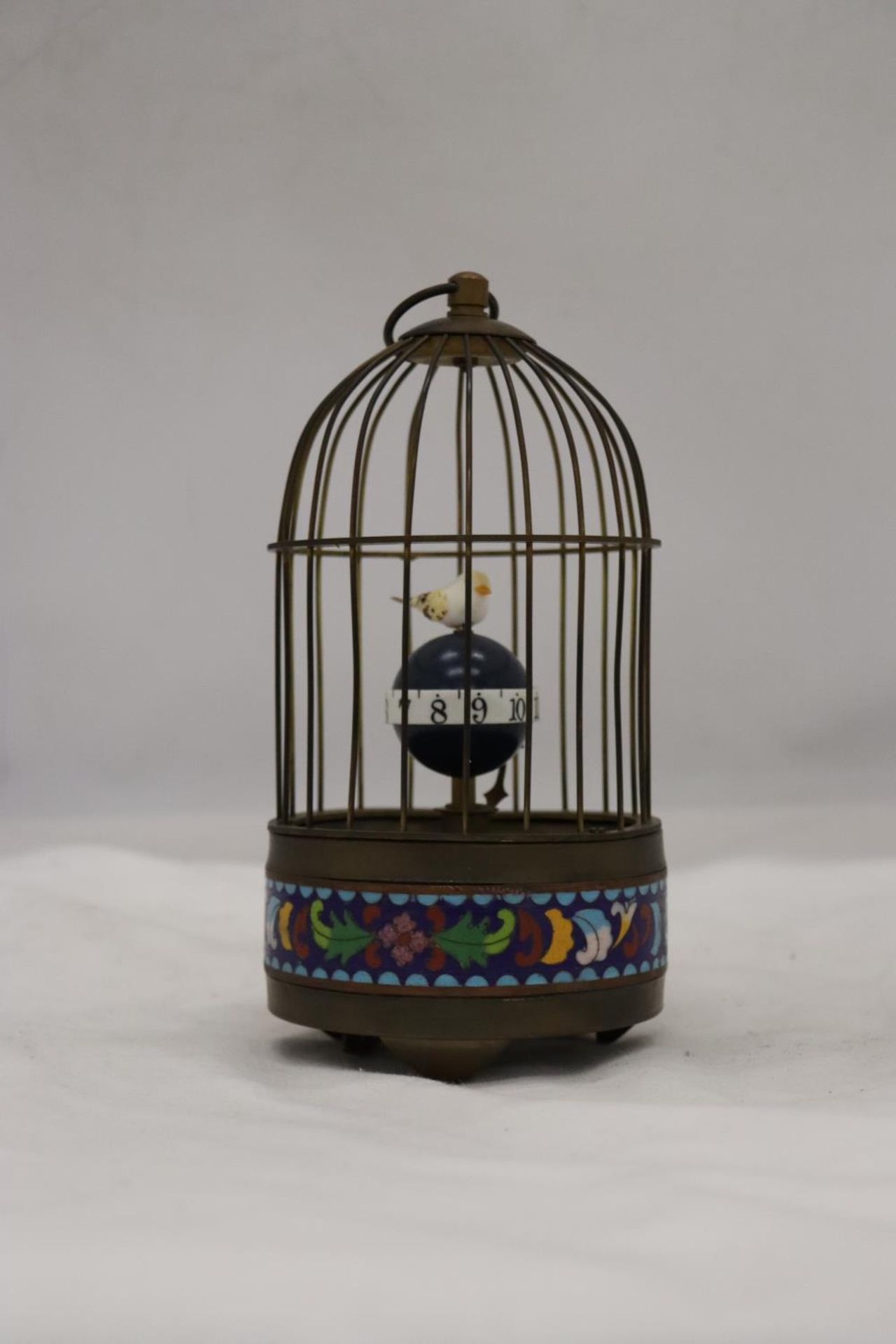 A MECHANICAL BRASS BIRD CAGE CLOCK