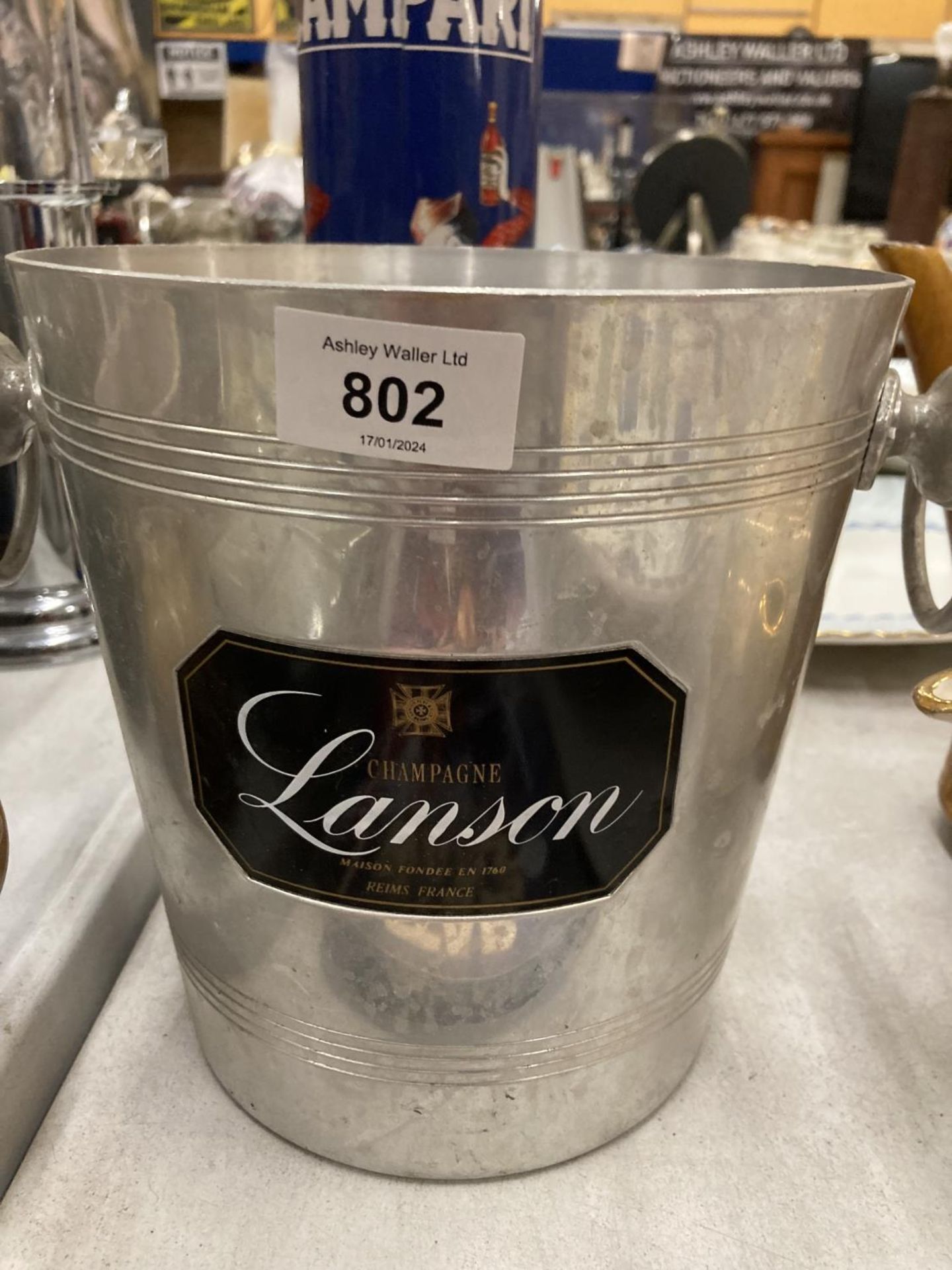A LANSON CHAMPAGNE ICE BUCKET, HEIGHT 20CM, DIAMETER 20CM AND A CAMPARI TUBE - Image 2 of 3