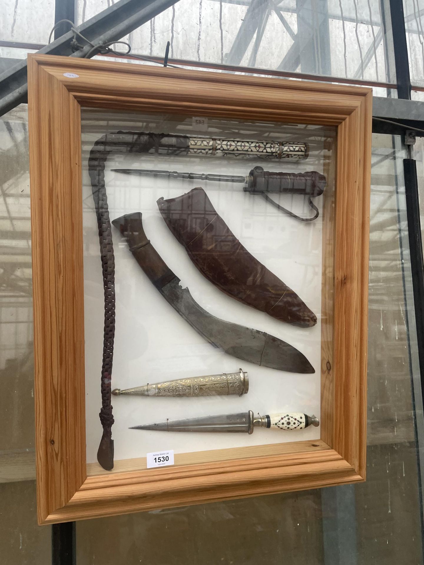 A PINE DISPLAY WALL HANGING FRAME WITH AN ASSORTMENT OF KNIVES