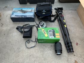 AN ASSORTMENT OF PHOTOGRAPHY ITEMS TO INCLUDE A TRIPOD STAND, A CAMERA AND A CAMERA LENS ETC