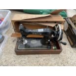 A VINTAGE SINGER SEWING MACHINE WITH A CARRY CASE