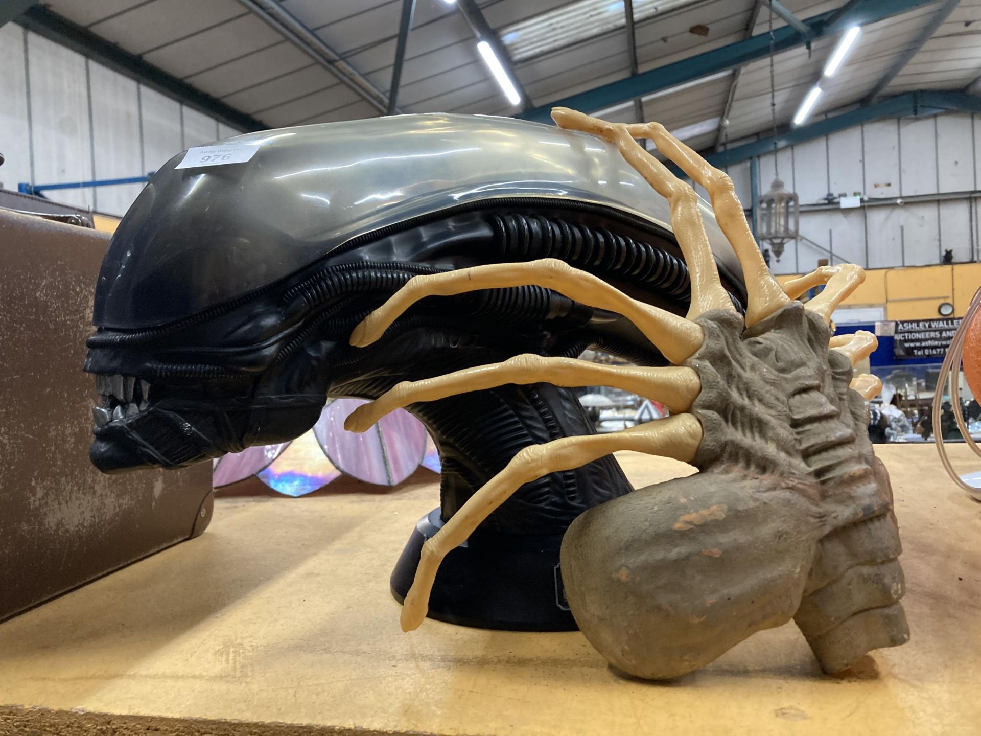A LARGE ALIEN HEAD AND CLAW CELEBRATING ALIEN 25TH ANNIVERSARY