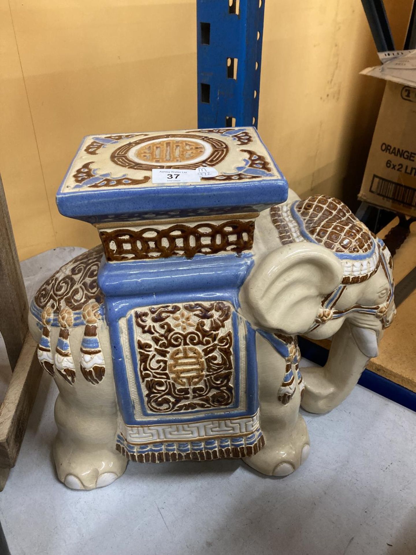 A LARGE CERAMIC ELEPHANT STAND/SEAT