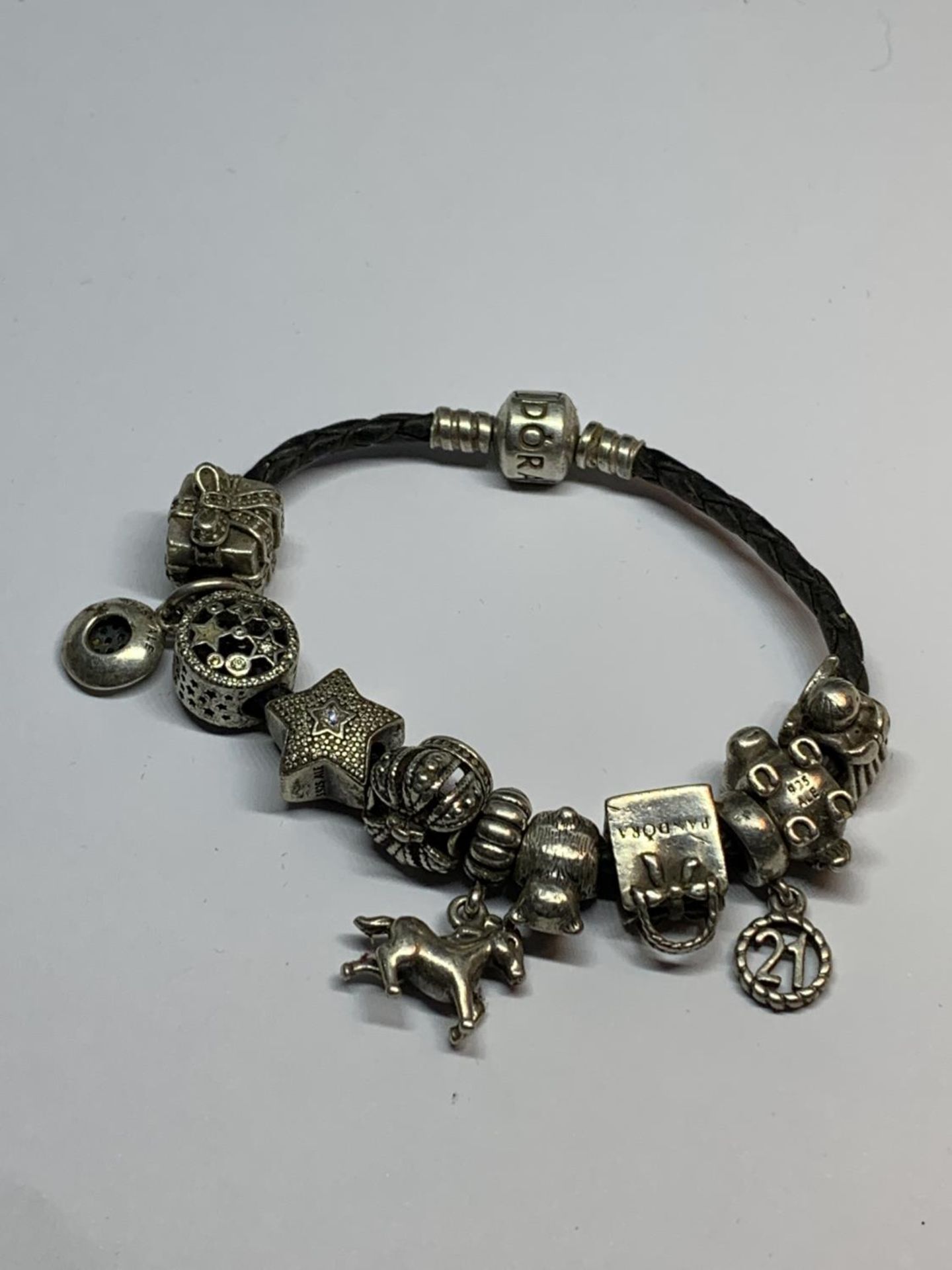 A PANDORA BRACELET WITH ELEVEN CHARMS