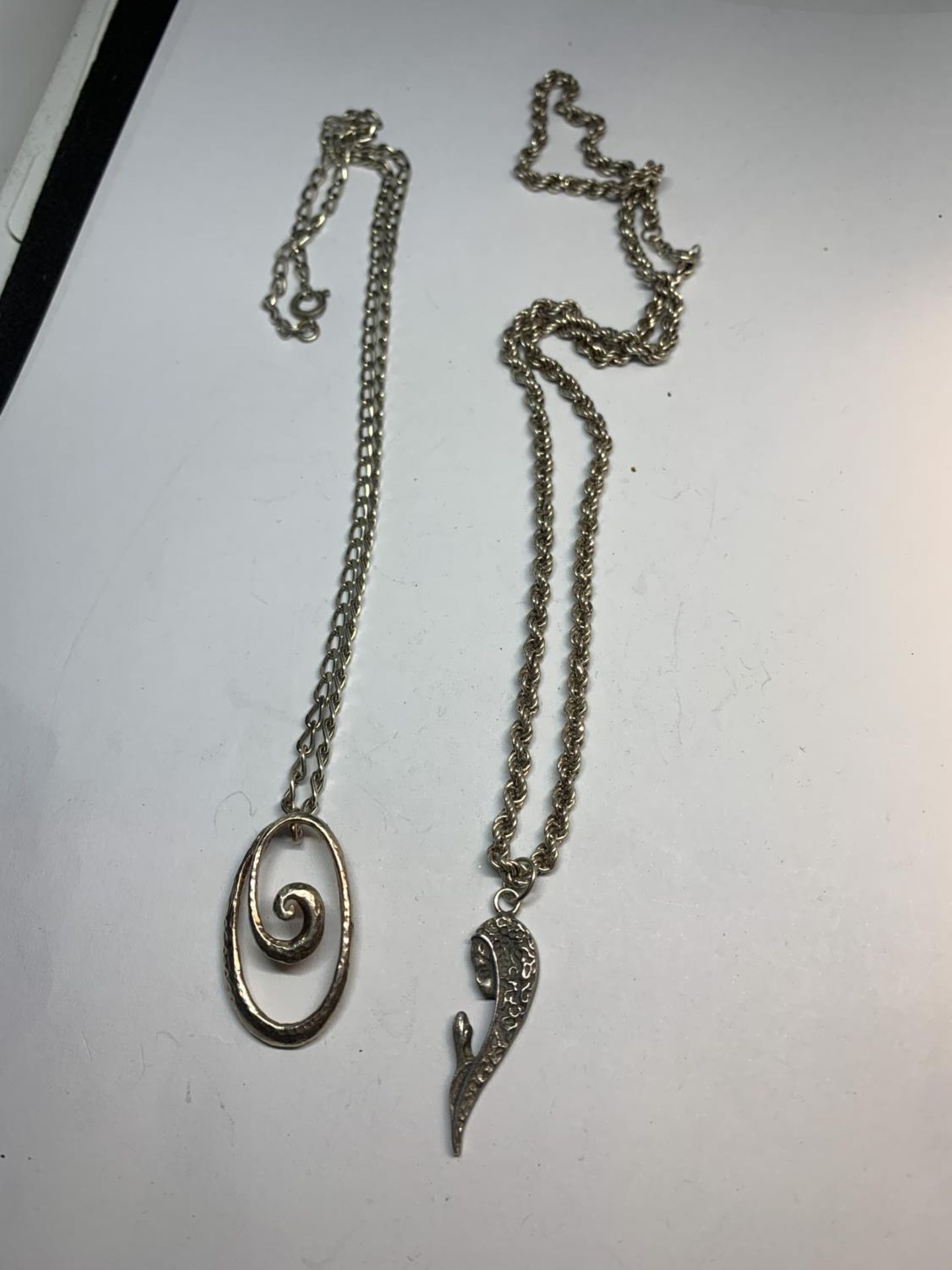 TWO HEAVY SILVER NECKLACES WITH PENDANTS