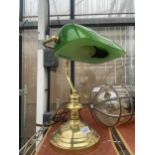 A BRASS BANKERS LAMP WITH GREEN GLASS SHADE