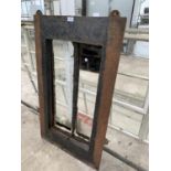 A VINTAGE CAST IRON WINDOW FRAME