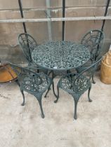 A VINTAGE STYLE GARDEN BISTRO SET COMPRISING OF A ROUND TABLE AND FOUR CHAIRS