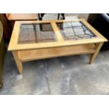 A MODERN HARDWOOD TWO TIER COFFEE TABLE WITH INSET GLASS TOP
