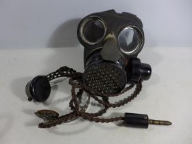 A RARE WORLD WAR II GAS MASK WITH INTEGRAL HEADSET AND MICROPHONE