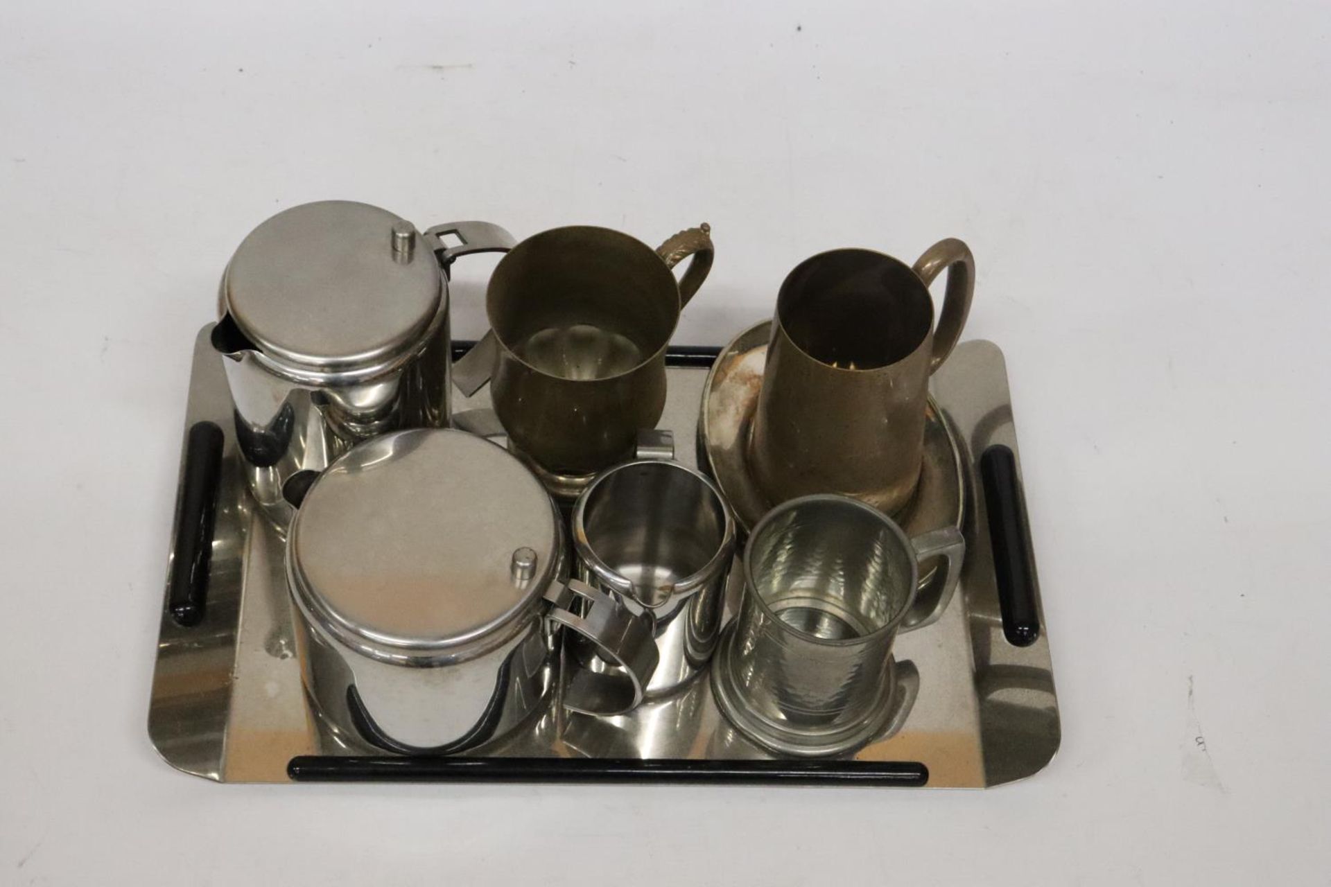 TWO BRASS TANKARDS, A PEWTER TANKARD, STAINLESS STEEL TEA POT, HOT WATER JUG AND CREAM JUG ON A TRAY - Image 2 of 5