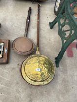 A VINTAGE BRASS BED WARMING PAN AND A VINTAGE COPPER BED PAN