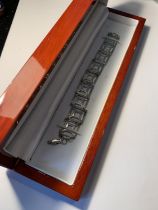 A SILVER BRACELET IN A PRESENTATION BOX