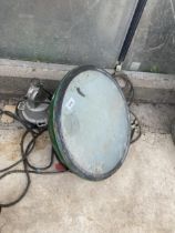 A VINTAGE INDUSTRIAL LIGHT FITTING WITH GREEN ENAMEL SHADE