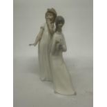 A NAO FIGURE OF A GIRL YAWNING TOGETHER WITH A MIQUEL REQUENA S.A. FIGURE OF A GIRL HOLDING A CANDLE