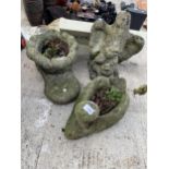 THREE VARIOUS CONCRETE GARDEN ITEMS TO INCLUDE A BOOT PLANTER AND AN EAGLE ETC