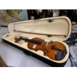 A NEW VIOLIN IN CASE WITH BOW