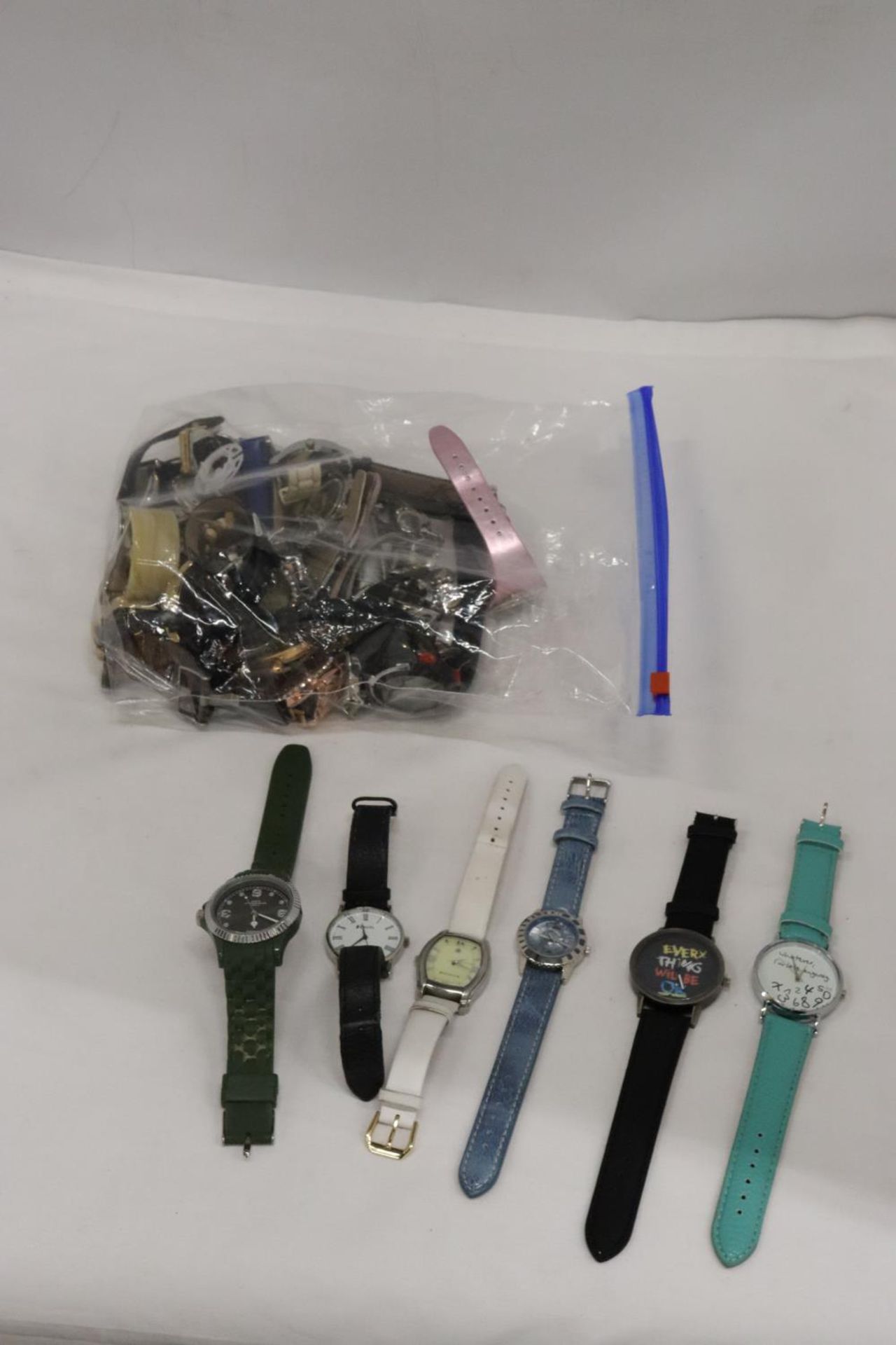 A LARGE COLLECTION OF WRIST WATCHES