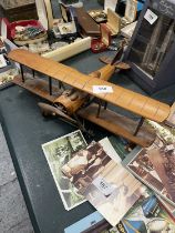 A WOODEN MODEL OF A BRITISH WW1 FIGHTER BI-PLANE, HEIGHT 11CM, WING SPAN 38CM